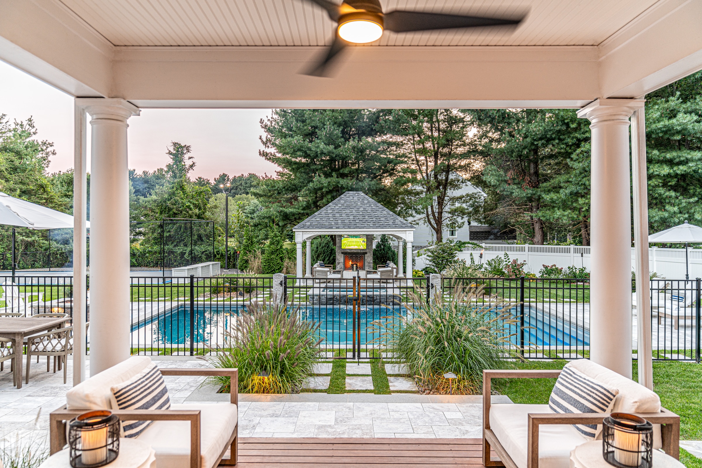 Stone paver walkway leading to pool and gazebo In Andover, Massachusetts. Dex by Terra Landscape design / build project.