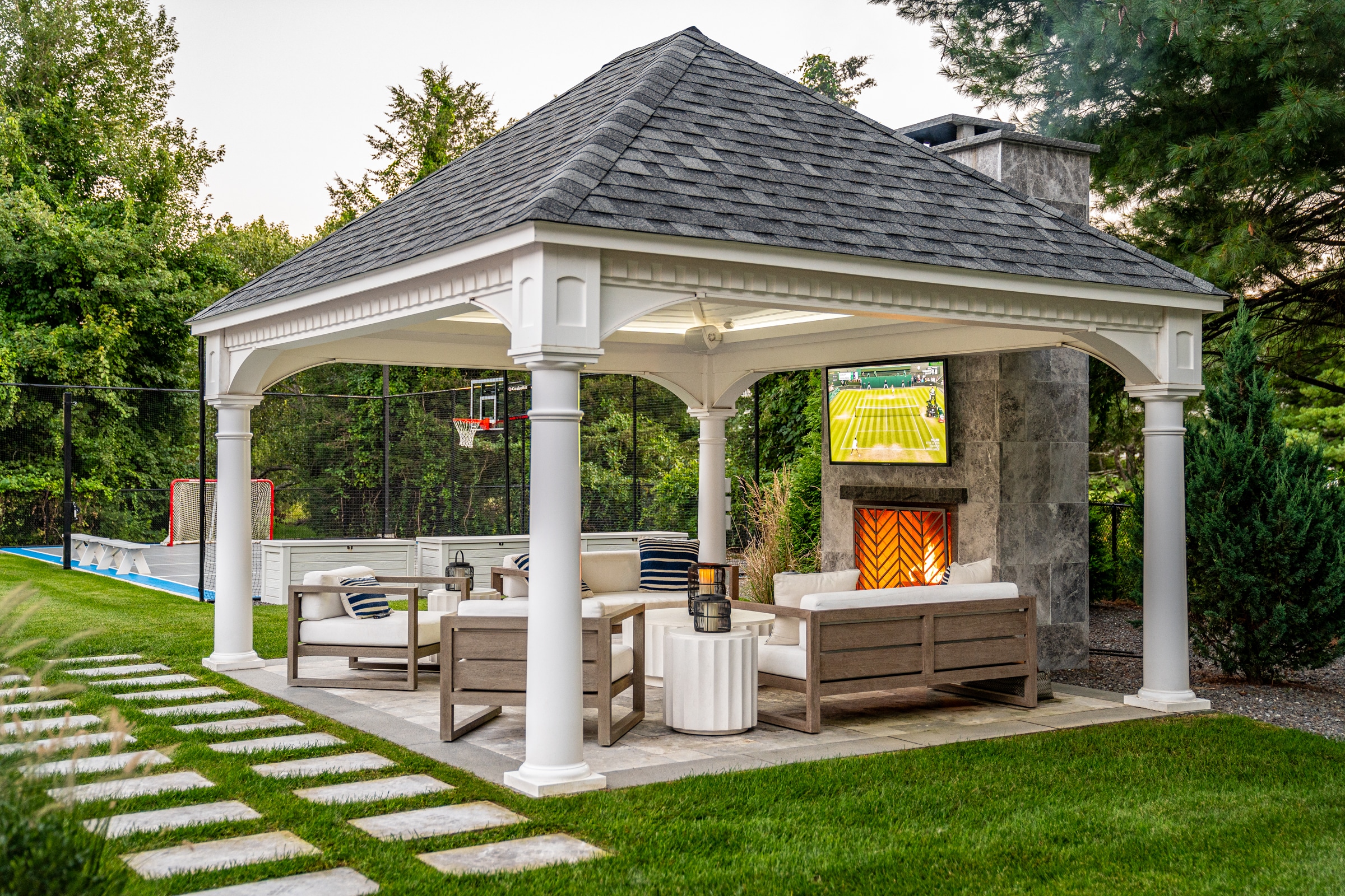 Gazebo with outdoor fireplace in Andover, Massachusetts. Patio and Fireplace masonry designed and built by Dex by Terra.